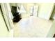 A living room features tiled floors and a television with lots of space at 3318 Boca Ciega N Dr, St Petersburg, FL 33710