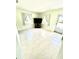 A living room features tiled floors and a television with lots of space at 3318 Boca Ciega N Dr, St Petersburg, FL 33710