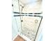 Updated shower with glass door and decorative stone flooring at 3318 Boca Ciega N Dr, St Petersburg, FL 33710