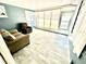 A sunroom with two comfortable chairs and windows for natural light at 3318 Boca Ciega N Dr, St Petersburg, FL 33710