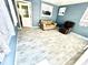 A sunroom with two comfortable chairs and windows for natural light at 3318 Boca Ciega N Dr, St Petersburg, FL 33710
