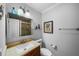 Full bathroom featuring tile floors, earth tone finishes, and a built in vanity at 3918 Versailles Dr, Tampa, FL 33634