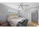 This bedroom features a ceiling fan, closet and a light color scheme at 3918 Versailles Dr, Tampa, FL 33634