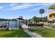 Dockside seating with a lift for a boat, as well as landscaping and access to a beautiful waterway at 3918 Versailles Dr, Tampa, FL 33634