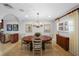 Formal dining room with a round table, chandelier, and window providing natural light at 3918 Versailles Dr, Tampa, FL 33634