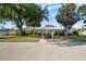 Charming single-story home featuring manicured landscaping, a well-maintained lawn, and a classic suburban aesthetic at 3918 Versailles Dr, Tampa, FL 33634