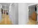 Hallway with closet leading to a bedroom with tile floors and neutral walls at 3918 Versailles Dr, Tampa, FL 33634