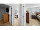 Hallway view with open doorways leading to bedrooms, showcasing bright interior and neutral tones at 3918 Versailles Dr, Tampa, FL 33634