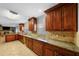 Spacious eat-in kitchen featuring granite countertops and tile floors at 3918 Versailles Dr, Tampa, FL 33634