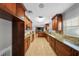 Large eat-in kitchen with granite countertops, stone backsplash, and tile floors at 3918 Versailles Dr, Tampa, FL 33634