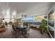 This lanai features a table and chairs and a view of the outside at 3918 Versailles Dr, Tampa, FL 33634