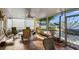 This lanai offers a table and chairs and a relaxing view at 3918 Versailles Dr, Tampa, FL 33634