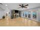 Inviting living room boasts a stone fireplace and double glass doors, merging indoor and outdoor spaces at 3918 Versailles Dr, Tampa, FL 33634