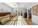 Bright main bedroom with ceiling fan, shuttered windows, and access to the outdoors through glass doors to patio at 3918 Versailles Dr, Tampa, FL 33634