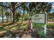 Community sign for Skyway Sports Complex with well-maintained landscaping in a sunny location at 3918 Versailles Dr, Tampa, FL 33634