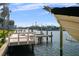 Beautiful view of the waterfront featuring a private boat lift and dock, ideal for enjoying the water at 3918 Versailles Dr, Tampa, FL 33634