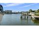 Picturesque waterfront view featuring a private boat dock and lift, perfect for boating enthusiasts and waterfront living at 3918 Versailles Dr, Tampa, FL 33634