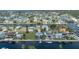 Aerial view of home on a canal in a residential community with other waterfront properties at 4290 Carlos Ct, Hernando Beach, FL 34607