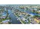 Aerial view of waterfront neighborhood, highlighting canal access and proximity to open water at 4290 Carlos Ct, Hernando Beach, FL 34607