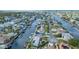 Aerial photograph captures a home situated on a canal within a community close to the Gulf of Mexico at 4290 Carlos Ct, Hernando Beach, FL 34607