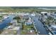 Drone shot of home near a harbor, offering a peek at the waterfront neighborhood and its surroundings at 4290 Carlos Ct, Hernando Beach, FL 34607