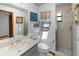 Bright bathroom with a glass enclosed shower, coastal decor and updated vanity at 4290 Carlos Ct, Hernando Beach, FL 34607