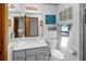 Bright bathroom features a glass enclosed shower, coastal decor and an updated vanity at 4290 Carlos Ct, Hernando Beach, FL 34607