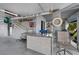 Covered entertainment area features bar with seating, life preserver, and nautical decor at 4290 Carlos Ct, Hernando Beach, FL 34607