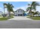 This waterfront two-story home has a two-car garage and space for boat storage underneath the house at 4290 Carlos Ct, Hernando Beach, FL 34607