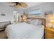 Bright main bedroom with a king bed, neutral decor, and an en-suite bathroom at 4290 Carlos Ct, Hernando Beach, FL 34607