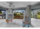 Covered patio with rocking chairs, perfect for enjoying waterfront views at 4290 Carlos Ct, Hernando Beach, FL 34607