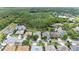 An aerial view highlighting homes with pools, backing onto a serene natural environment with lush vegetation at 4608 Kilcoyne Ct, Lutz, FL 33558