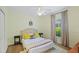 This bedroom has an upholstered headboard, neutral colors, and bright pillows at 4608 Kilcoyne Ct, Lutz, FL 33558