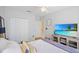 This bedroom features a large window, closet, and comfortable furnishing at 4608 Kilcoyne Ct, Lutz, FL 33558