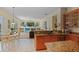 Inviting kitchen with stainless steel appliances, granite countertops, backyard views, and tile flooring at 4608 Kilcoyne Ct, Lutz, FL 33558