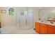 Well-lit main bathroom features a soaking tub, glass shower, double windows and a wood vanity at 4608 Kilcoyne Ct, Lutz, FL 33558