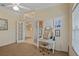 Bright office with French doors, natural light, and a modern work desk setup at 4608 Kilcoyne Ct, Lutz, FL 33558