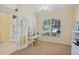 Bright home office featuring a large window and a work desk with a comfortable chair at 4608 Kilcoyne Ct, Lutz, FL 33558