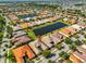 Expansive aerial view showcases a serene community with multiple ponds and neatly arranged homes, creating a peaceful residential setting at 4961 Marble Springs Cir, Wimauma, FL 33598