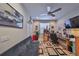 Versatile bonus bedroom features a comfortable futon, desk space, and ample storage at 4961 Marble Springs Cir, Wimauma, FL 33598