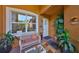 Cozy front porch with comfortable seating and decorative plants creating a welcoming entrance at 4961 Marble Springs Cir, Wimauma, FL 33598