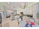 Modern kitchen featuring white cabinetry, stainless steel appliances, and a breakfast table area at 4961 Marble Springs Cir, Wimauma, FL 33598