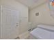 Bright laundry room features modern machines and ample storage space at 4961 Marble Springs Cir, Wimauma, FL 33598