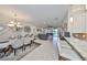 Open-concept living space with dining area, kitchen bar, and comfortable seating arrangement at 4961 Marble Springs Cir, Wimauma, FL 33598