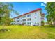 The lush backyard features mature trees and well-maintained lawn space at 5660 80Th N St # D207, St Petersburg, FL 33709