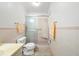 This bathroom features a walk-in shower with tiled walls, a toilet, and a vanity at 5660 80Th N St # D207, St Petersburg, FL 33709