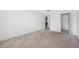Bedroom with neutral walls, natural light, and walk-in closet at 5660 80Th N St # D207, St Petersburg, FL 33709