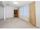 Bedroom with natural light and a wooden bookshelf at 5660 80Th N St # D207, St Petersburg, FL 33709