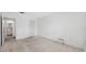 Bedroom with a walk-in closet, neutral walls, and view to a bathroom at 5660 80Th N St # D207, St Petersburg, FL 33709