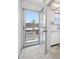 Foyer area with large windows and marble flooring showcasing the unit's entry at 5660 80Th N St # D207, St Petersburg, FL 33709